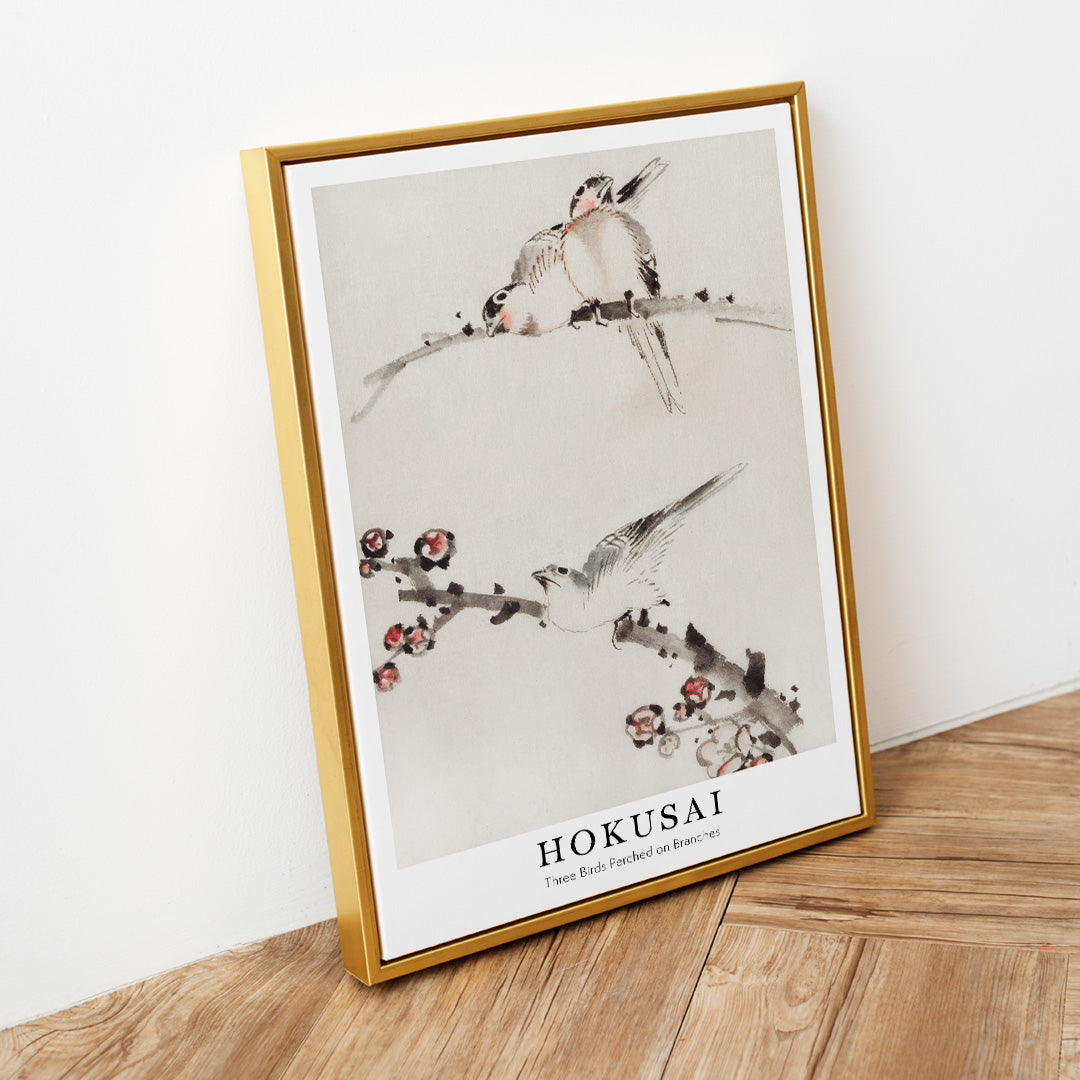 Three birds perched on branches with blossoms watercolor painting and poster artwork by Katsushika Hokusai, framed and displayed in home decor