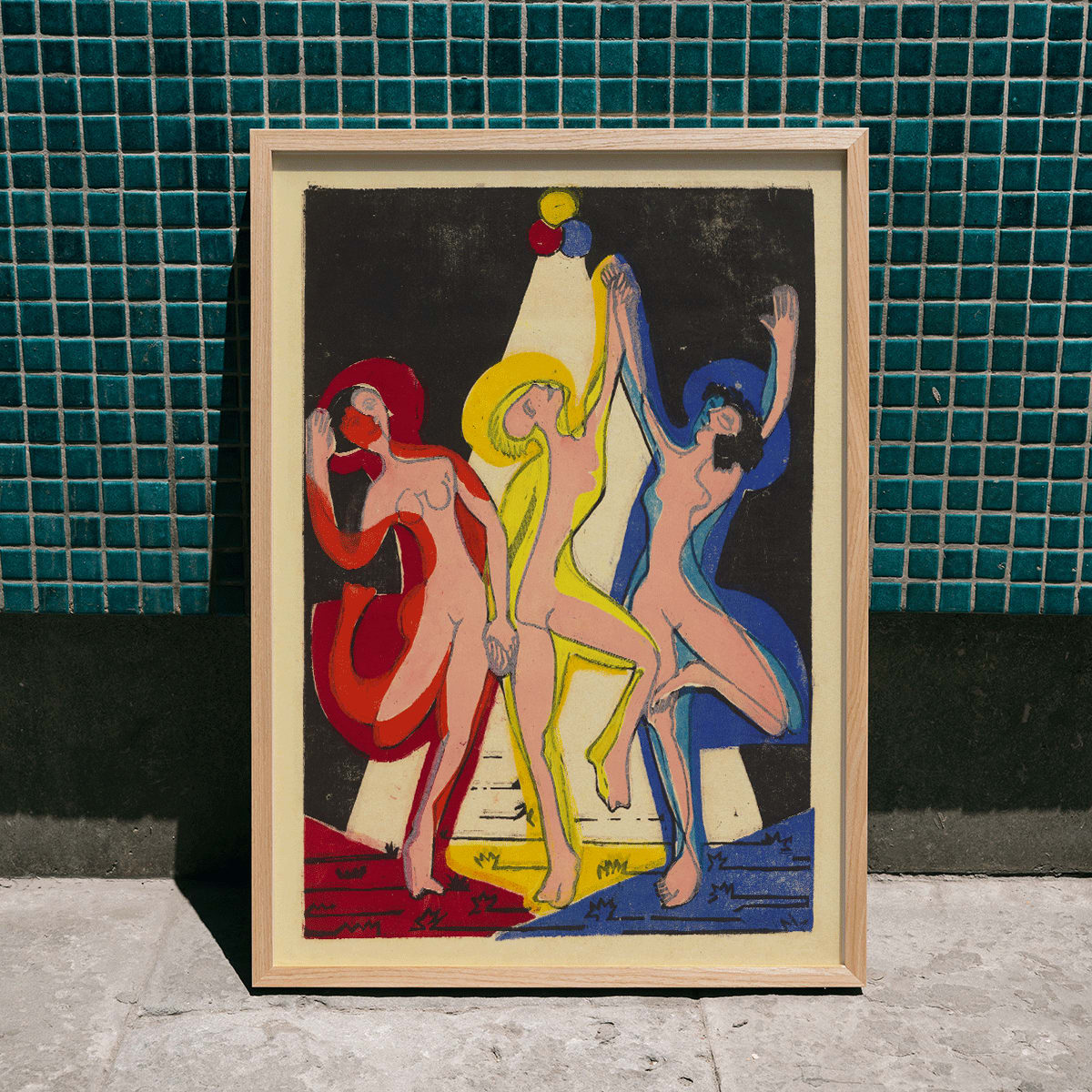 Dance of Colours by Ernst Ludwig Kirchner poster featuring three abstract dancing figures in vibrant hues, framed and displayed in home decor