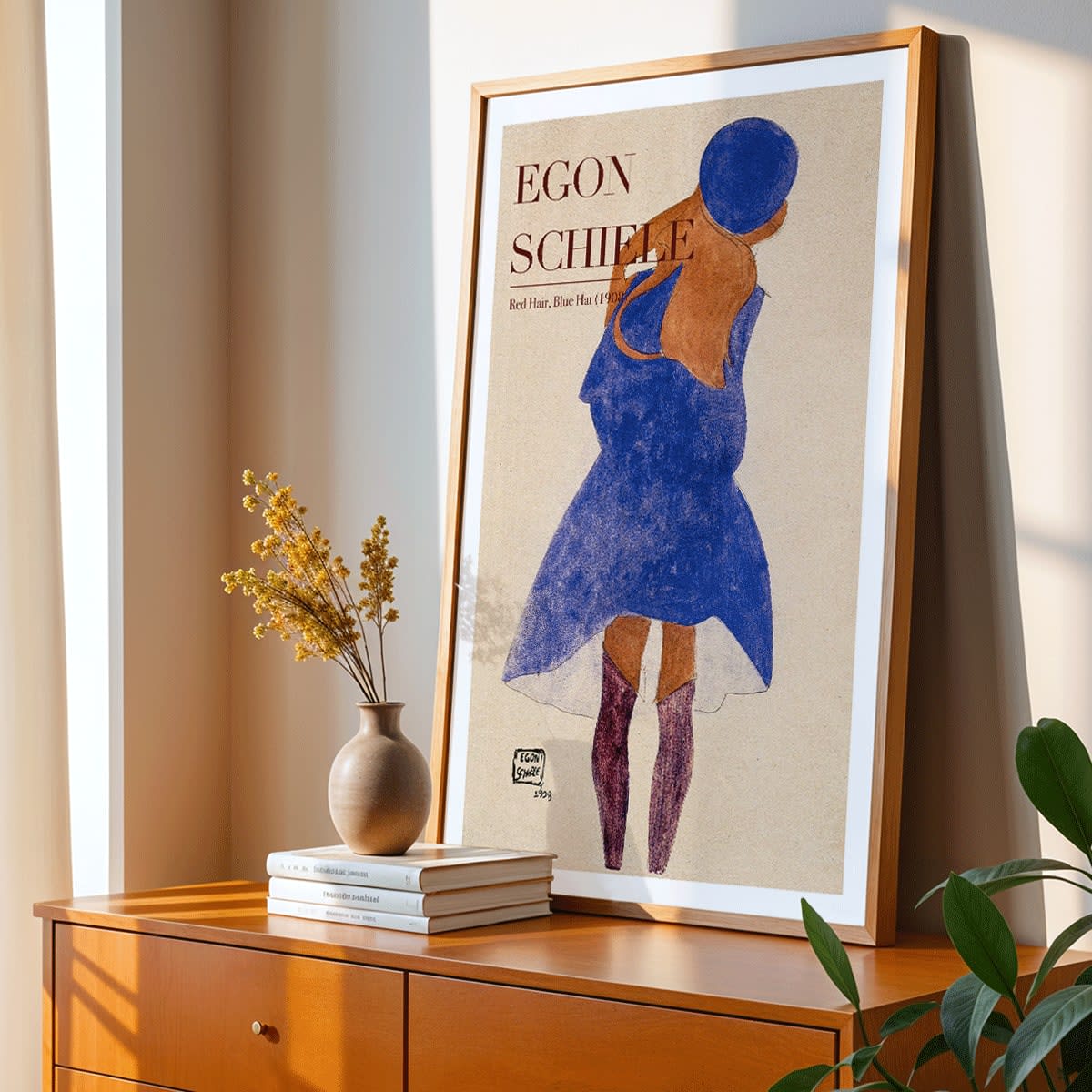 Egon Schiele exhibition poster featuring Red Hair Blue Hat artwork showing a woman with red hair in a blue dress and hat, framed and displayed in home decor