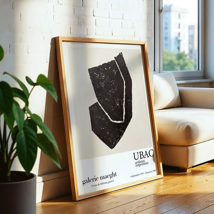 Ardoises Empreintes exhibition poster by Raoul Ubac featuring black abstract shapes and design on white from Galerie Maeght Paris, framed and displayed in modern living room decor