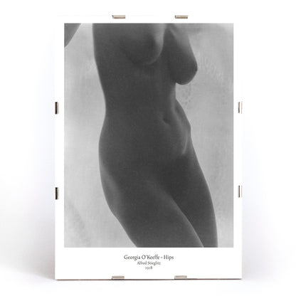 Black and white nude portrait of Georgia O Keeffe Hips by Alfred Stieglitz featuring torso photographic study poster, framed and displayed in modern living room decor