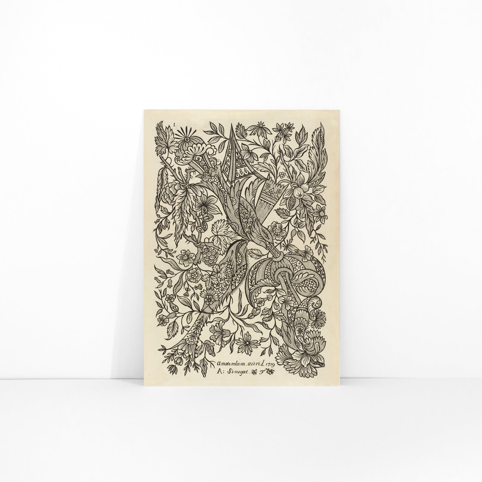 Intricate black and white floral textile pattern artwork poster by Alexander Senegat, framed and displayed in modern living room decor