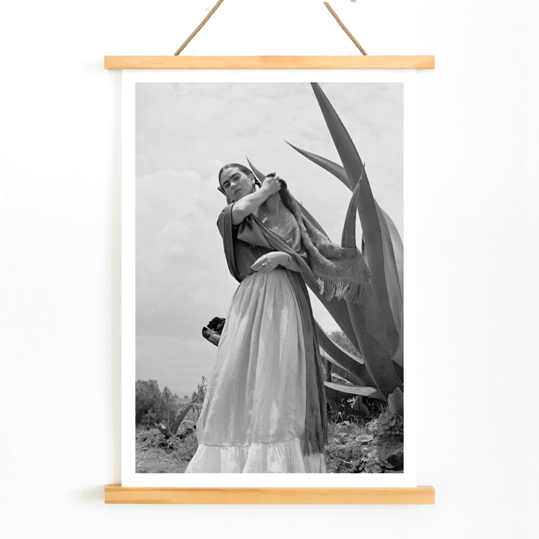 Frida Kahlo Senora Diego Rivera standing beside agave plant by Toni Frissell black and white artwork poster, with wooden magnetic frame on white background