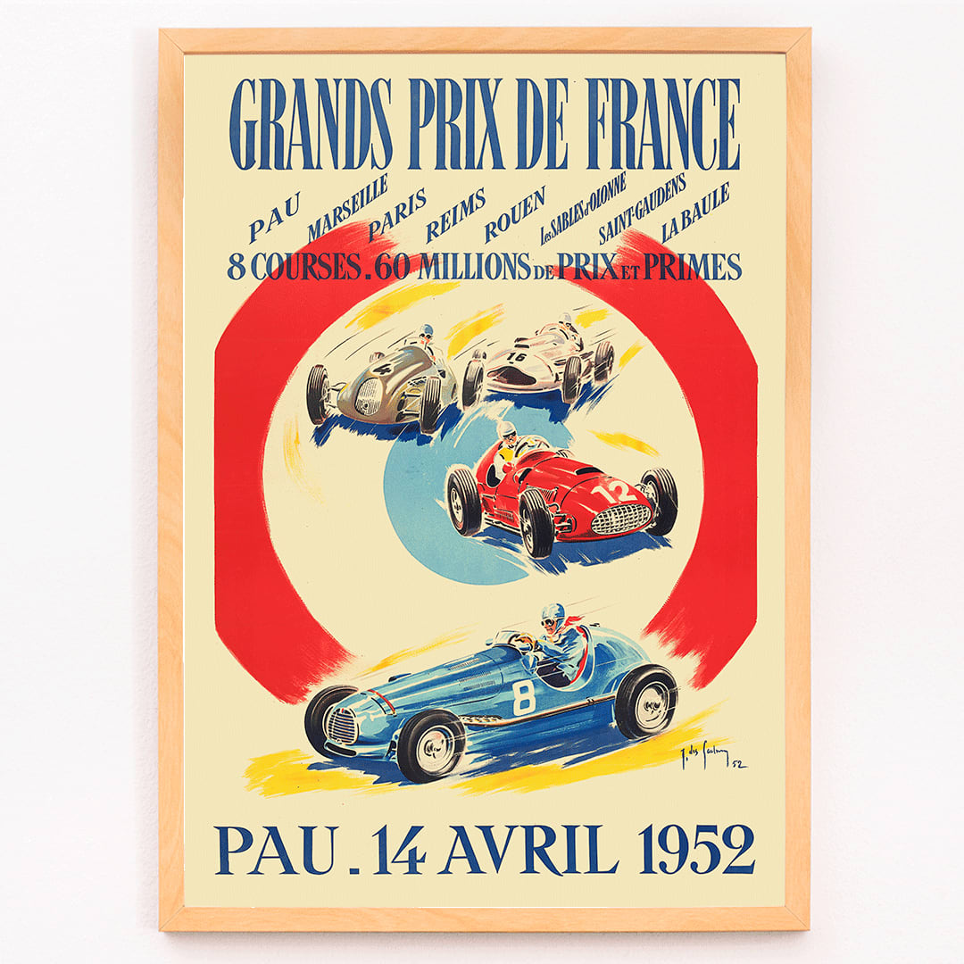 Vintage poster by Jean Des Gachons showing colorful race cars and event details for Grands Prix de France at multiple locations, framed and displayed in modern living room decor