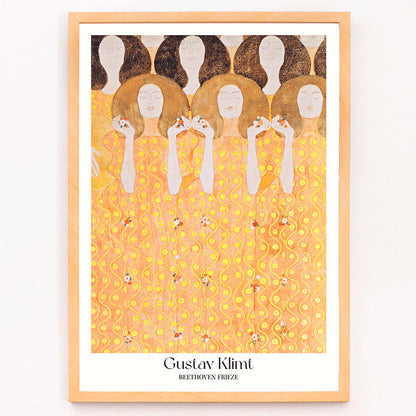Beethoven Frieze by Gustav Klimt featuring women in flowing yellow gowns with intricate golden and orange patterns and faceless figures, framed and displayed in modern living room decor