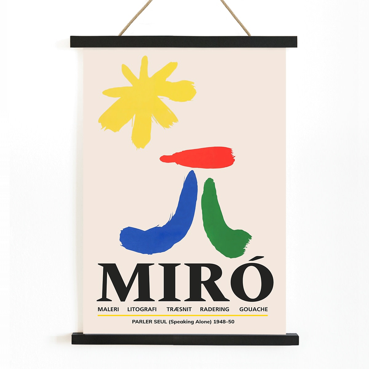 Parler Seul exhibition poster by Joan Miro with abstract colorful shapes on a light background, with wooden magnetic frame on white background