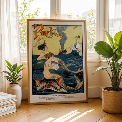 Vintage Puck Magazine illustration of mermaids sewing in a vibrant ocean scene with a boat in the background by Louis M Glackens and anonymous artist, framed and displayed in home decor