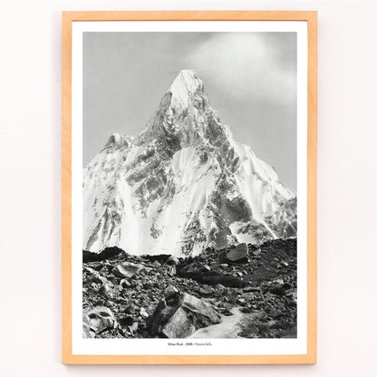 Mitre Peak surrounded by rocky terrain and snowy peak seen from Baltoro Glacier by Vittorio Sella, framed and displayed in modern living room decor