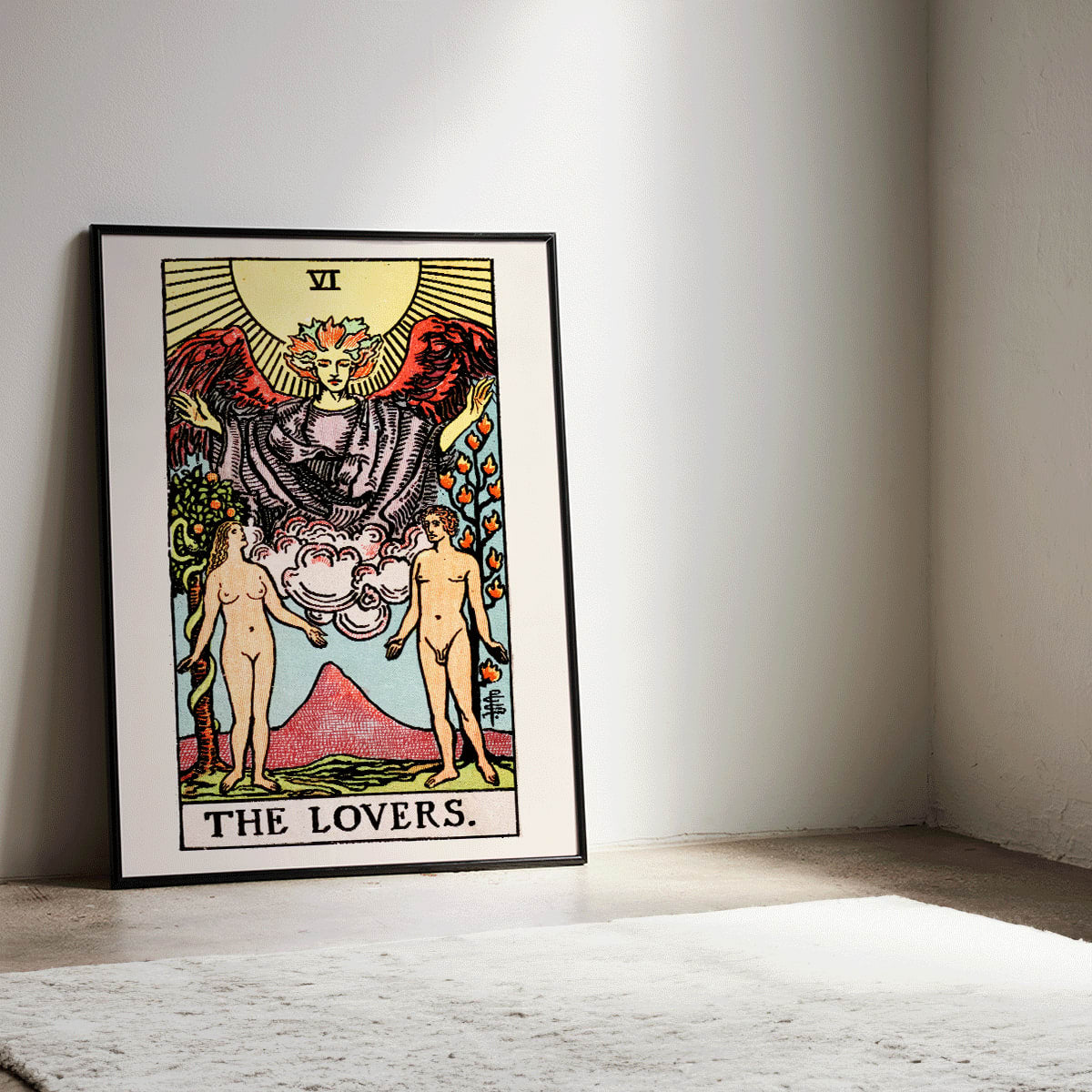 The Lovers Tarot card by Rider Waite featuring a winged angel above a man and woman in a garden illustration and poster, framed and displayed in modern living room decor