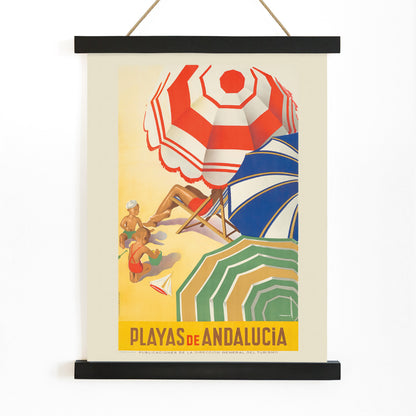 Vintage beach scene with colorful umbrellas children playing and sunbathers on sand Playas de Andalucia by Jose Morell tourism artwork, with wooden magnetic frame on white background