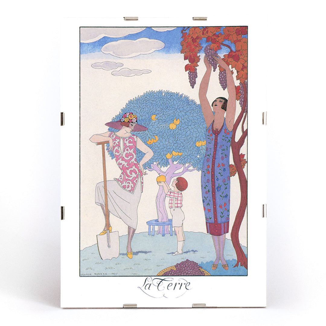 Art Deco illustration and poster by George Barbier featuring women and a child harvesting fruit in a colorful stylized garden, framed and displayed in modern living room decor